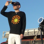 Lica Quaglia eclipse scientist looking through eclipse glasses